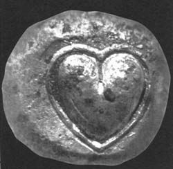 Ancient Cyrenean silver coin depicting a silphium seed or fruit
